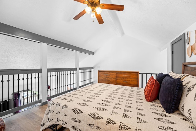 9 Scenic Ct Unit 9-9, Branson, MO 65616 - bedroom featuring wood finished floors, a ceiling fan, and lofted ceiling with beams