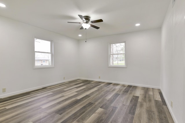 unfurnished room featuring ceiling fan, baseboards, wood finished floors, and recessed lighting