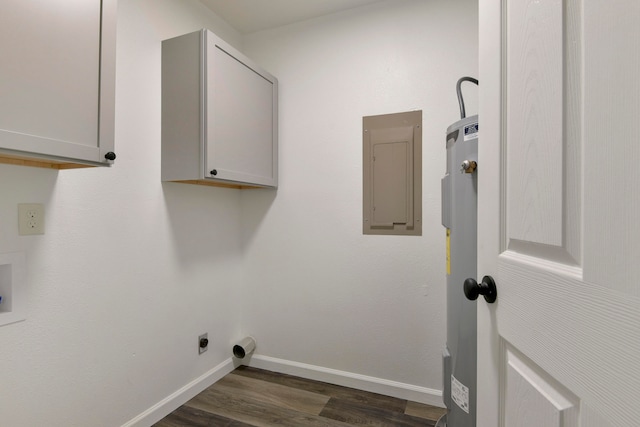 clothes washing area featuring hookup for an electric dryer, electric water heater, dark hardwood / wood-style flooring, electric panel, and cabinets