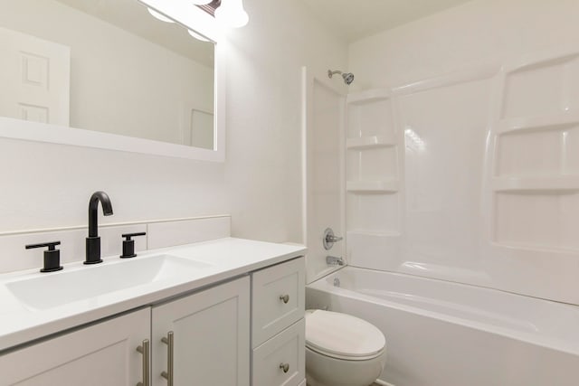 full bathroom with tub / shower combination, vanity, and toilet