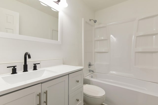 bathroom with toilet, vanity, and shower / bath combination