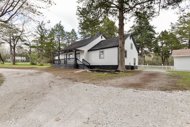 view of side of property featuring a porch