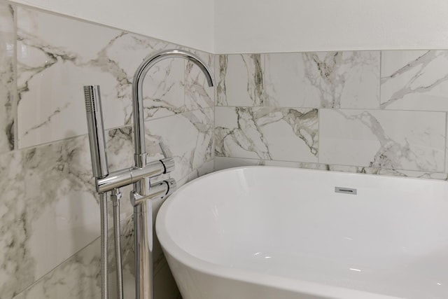 bathroom with a soaking tub