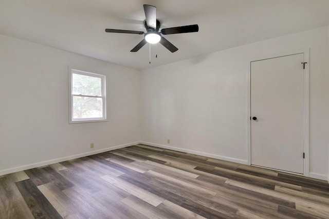 empty room featuring ceiling fan and hardwood / wood-style flooring