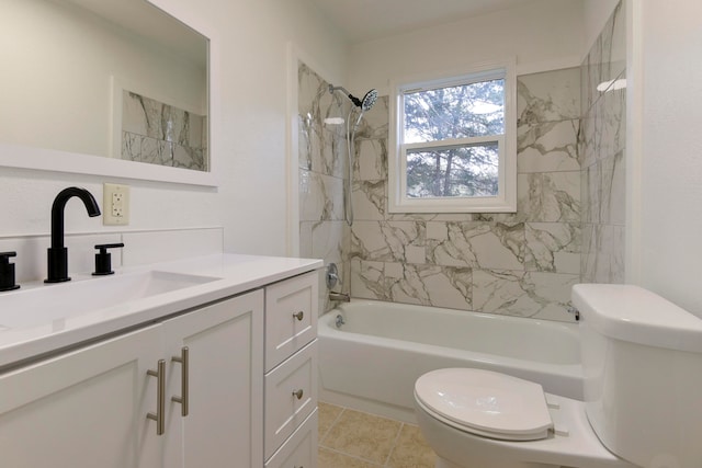 full bathroom featuring tiled shower / bath combo, tile patterned floors, vanity, and toilet