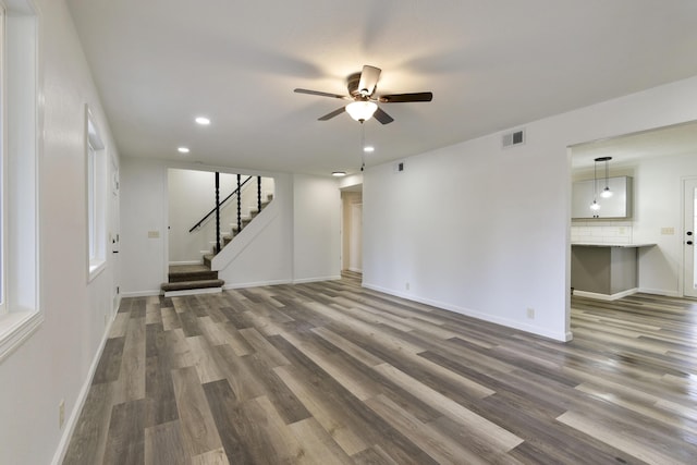 unfurnished living room with ceiling fan, dark wood-style flooring, visible vents, and recessed lighting