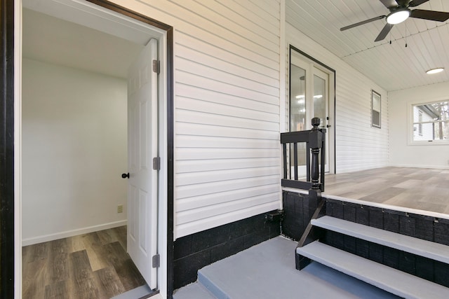 view of exterior entry featuring ceiling fan