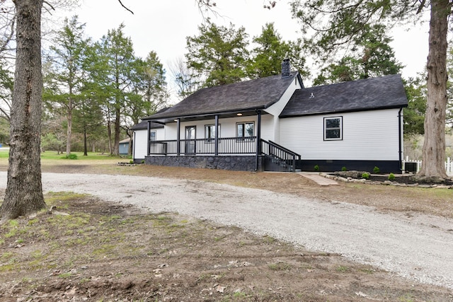 view of front of property featuring central air condition unit and a porch