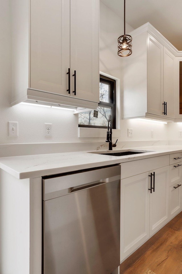 000 State Route Jj, West Plains, MO 65775 - kitchen featuring stainless steel dishwasher, a sink, hanging light fixtures, light wood-style floors, and white cabinetry