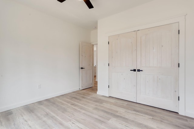 unfurnished bedroom featuring ceiling fan, a closet, and light hardwood / wood-style floors