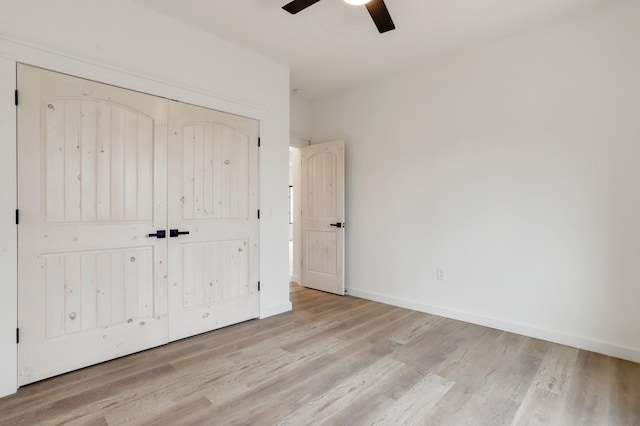 000 State Route Jj, West Plains, MO 65775 - unfurnished bedroom featuring baseboards, a ceiling fan, wood finished floors, and a closet