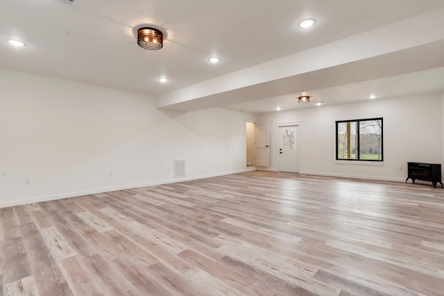 spare room featuring light wood-type flooring