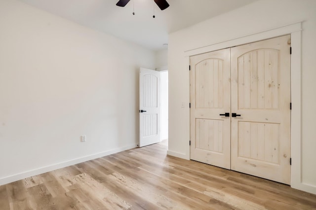 000 State Route Jj, West Plains, MO 65775 - unfurnished bedroom featuring a ceiling fan, baseboards, light wood-style floors, and a closet