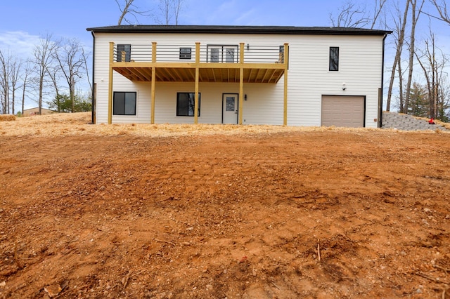 000 State Route Jj, West Plains, MO 65775 - rear view of property featuring an attached garage and a deck