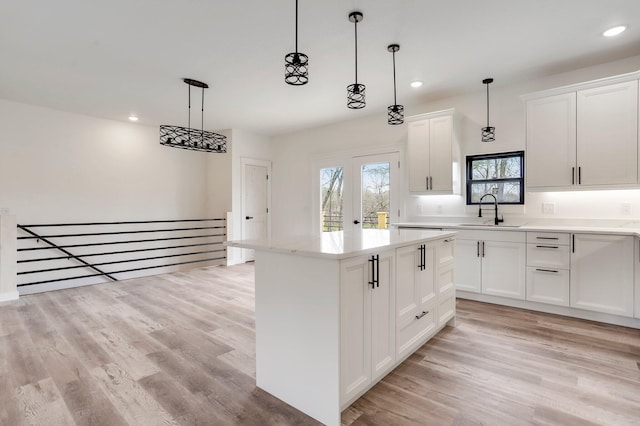 000 State Route Jj, West Plains, MO 65775 - kitchen with recessed lighting, decorative light fixtures, a center island, and a sink