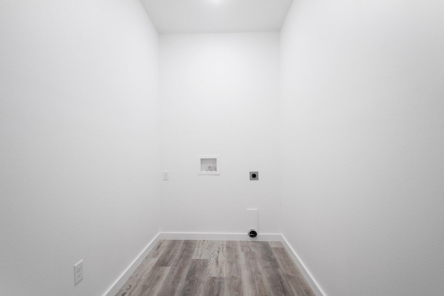 000 State Route Jj, West Plains, MO 65775 - laundry area with light wood-type flooring, baseboards, hookup for a washing machine, electric dryer hookup, and laundry area