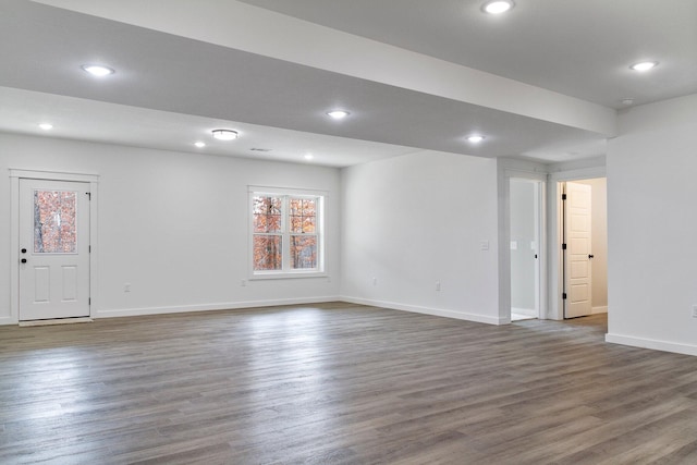 spare room with dark wood-type flooring