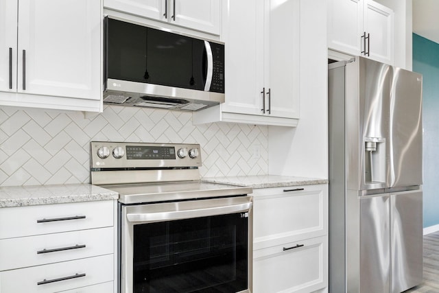 000 State Route Jj, West Plains, MO 65775 - kitchen featuring white cabinets, decorative backsplash, and appliances with stainless steel finishes