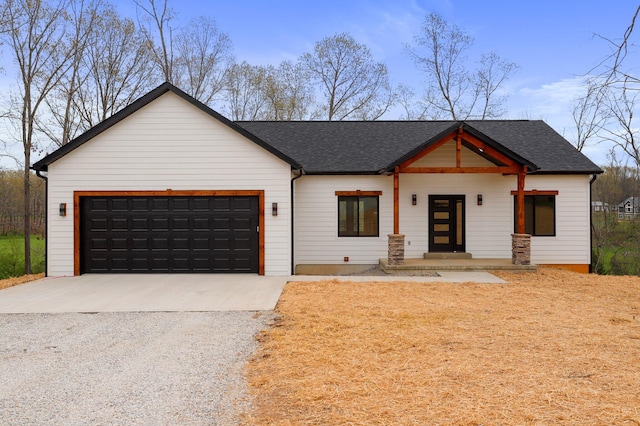 modern farmhouse with a garage and covered porch