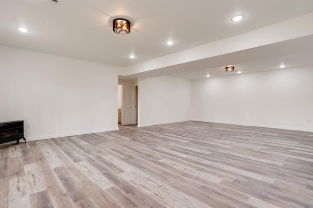 000 State Route Jj, West Plains, MO 65775 - finished below grade area featuring recessed lighting, light wood-style floors, a wood stove, and baseboards