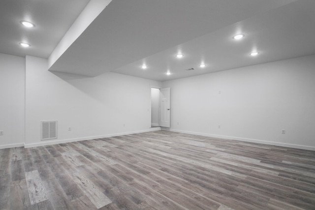 basement featuring hardwood / wood-style floors