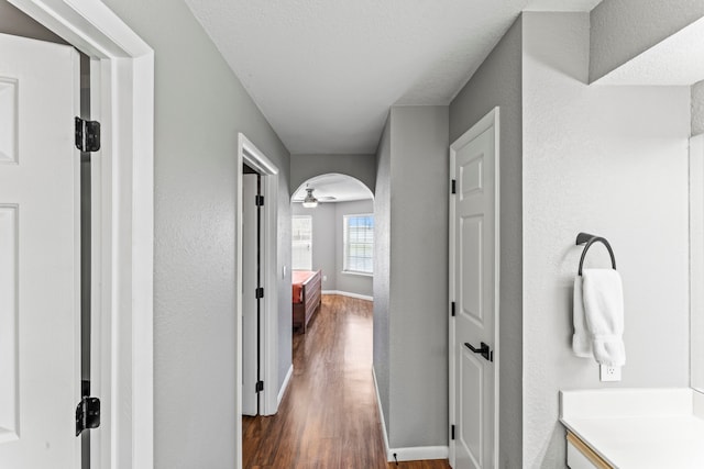 hallway with dark wood-type flooring