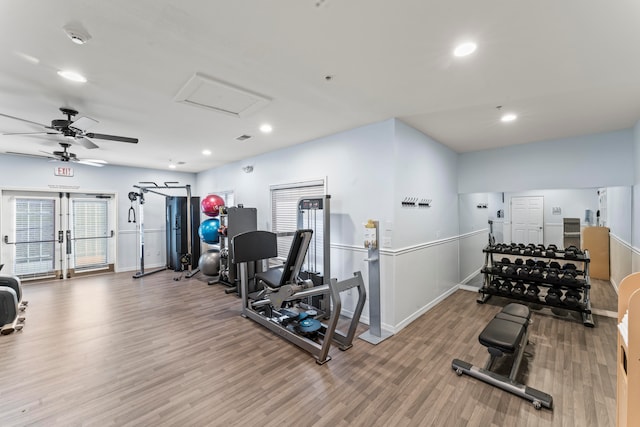 workout area featuring hardwood / wood-style flooring and ceiling fan