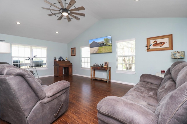 living room featuring ceiling fan, dark hardwood / wood-style floors, vaulted ceiling, and a healthy amount of sunlight