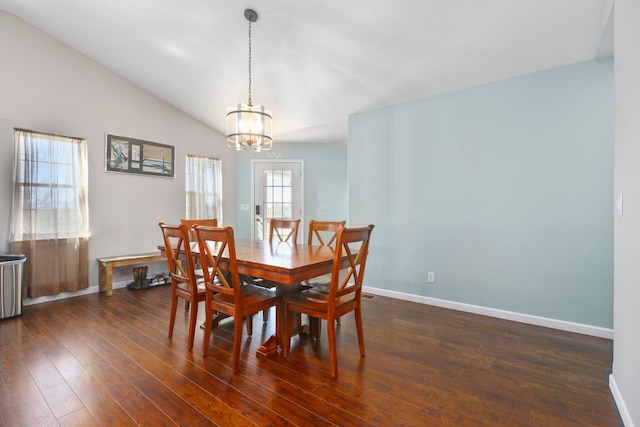 dining room featuring lofted ceiling, a chandelier, and dark hardwood / wood-style flooring