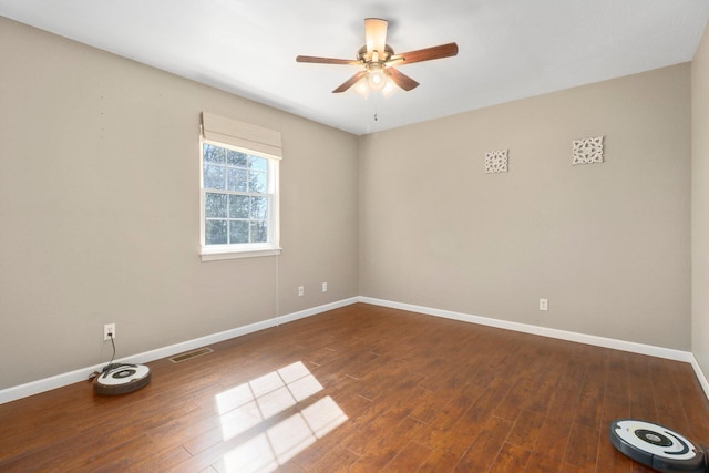 empty room with hardwood / wood-style flooring and ceiling fan