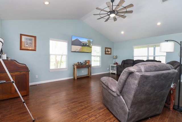 living room featuring lofted ceiling, a healthy amount of sunlight, and dark wood-type flooring