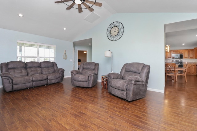 living room featuring ceiling fan, dark hardwood / wood-style floors, and vaulted ceiling