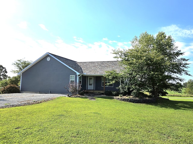 ranch-style home with a front lawn