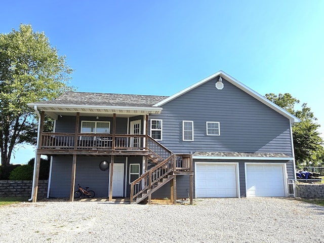 view of front of home with a garage and a porch