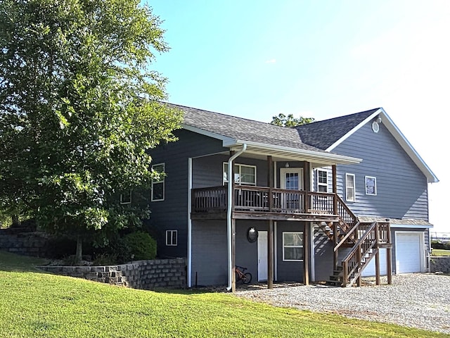 view of front of property featuring a garage, a front yard, and covered porch