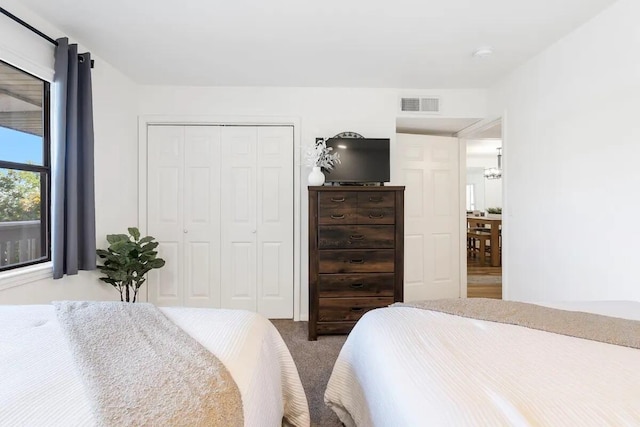 bedroom featuring a closet and carpet flooring