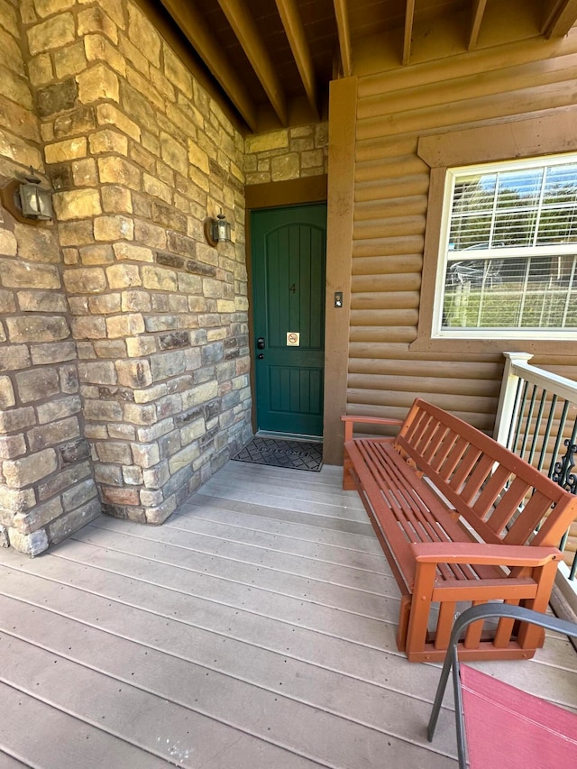 entrance to property with a wooden deck