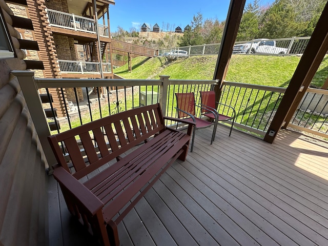 wooden deck with a yard