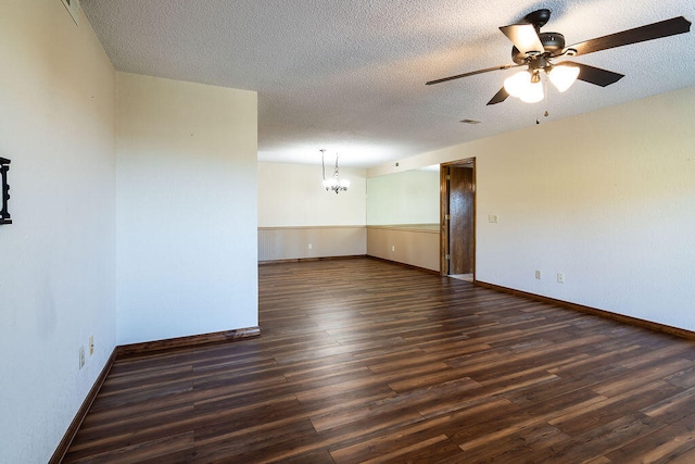 spare room featuring ceiling fan, a textured ceiling, and dark hardwood / wood-style floors