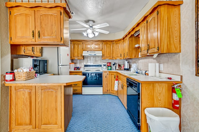 kitchen with black appliances, ceiling fan, tasteful backsplash, sink, and kitchen peninsula