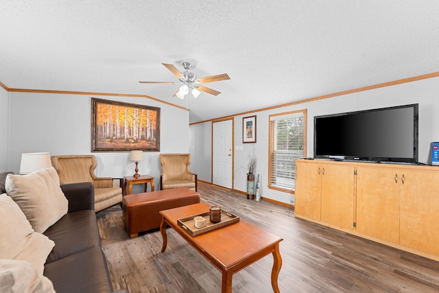 living room with ceiling fan, lofted ceiling, dark hardwood / wood-style floors, and crown molding