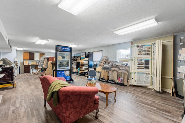 living room featuring hardwood / wood-style floors and a textured ceiling