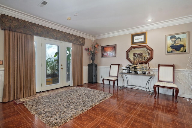 living area featuring ornamental molding, dark tile patterned floors, and french doors