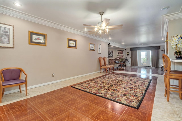 tiled living room featuring ceiling fan and ornamental molding