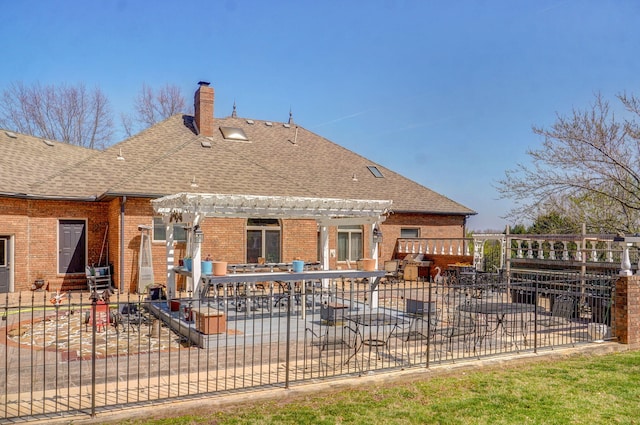 rear view of property featuring a patio area