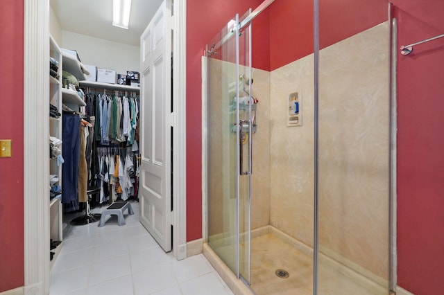 bathroom with tile patterned floors and an enclosed shower