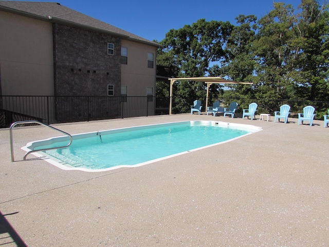 280 Tina St Unit 9, Hollister, MO 65672 - community pool with fence and a patio area