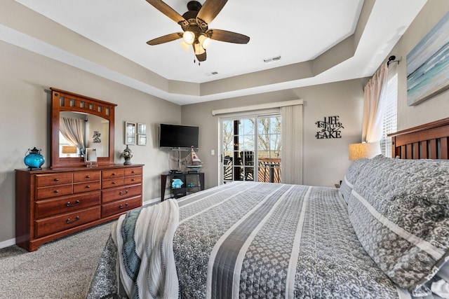 280 Tina St Unit 9, Hollister, MO 65672 - carpeted bedroom with a ceiling fan, baseboards, access to outside, and visible vents