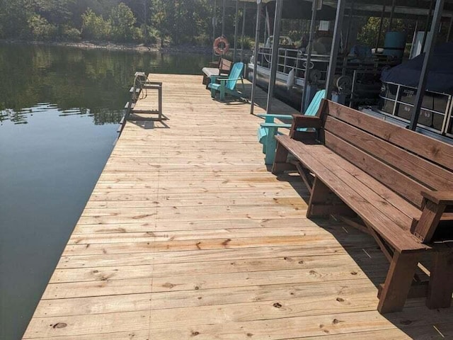 dock area with a water view