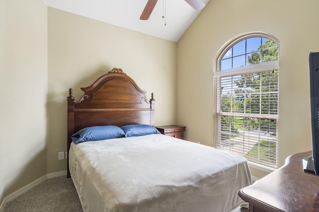 carpeted bedroom featuring lofted ceiling and ceiling fan